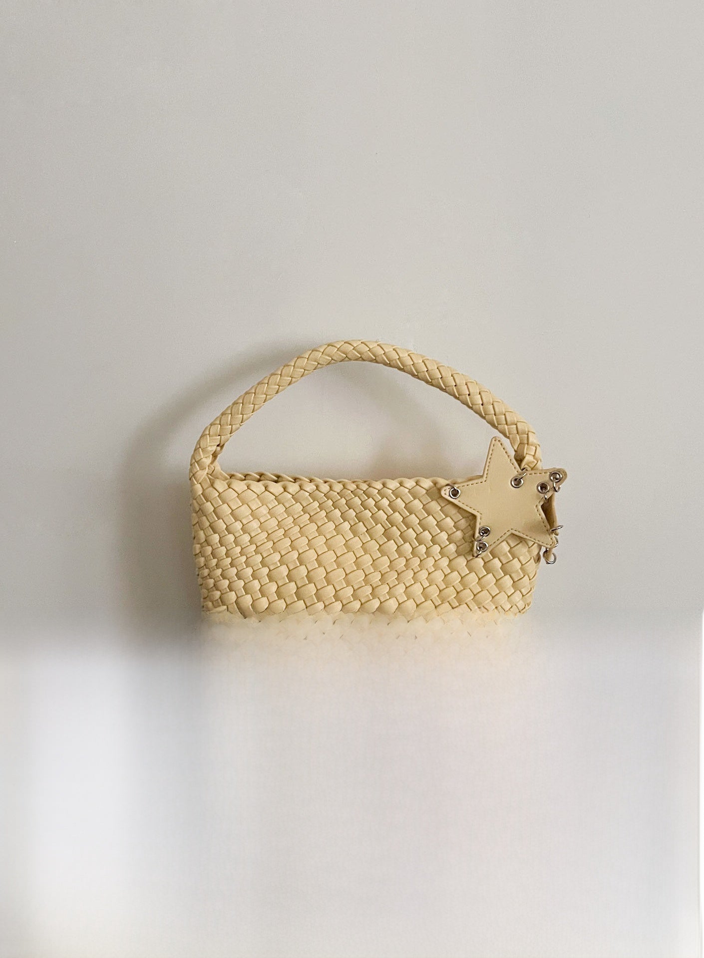 Champagne-colored woven tote bag