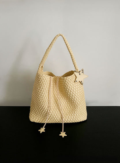 Champagne-colored woven tote bag