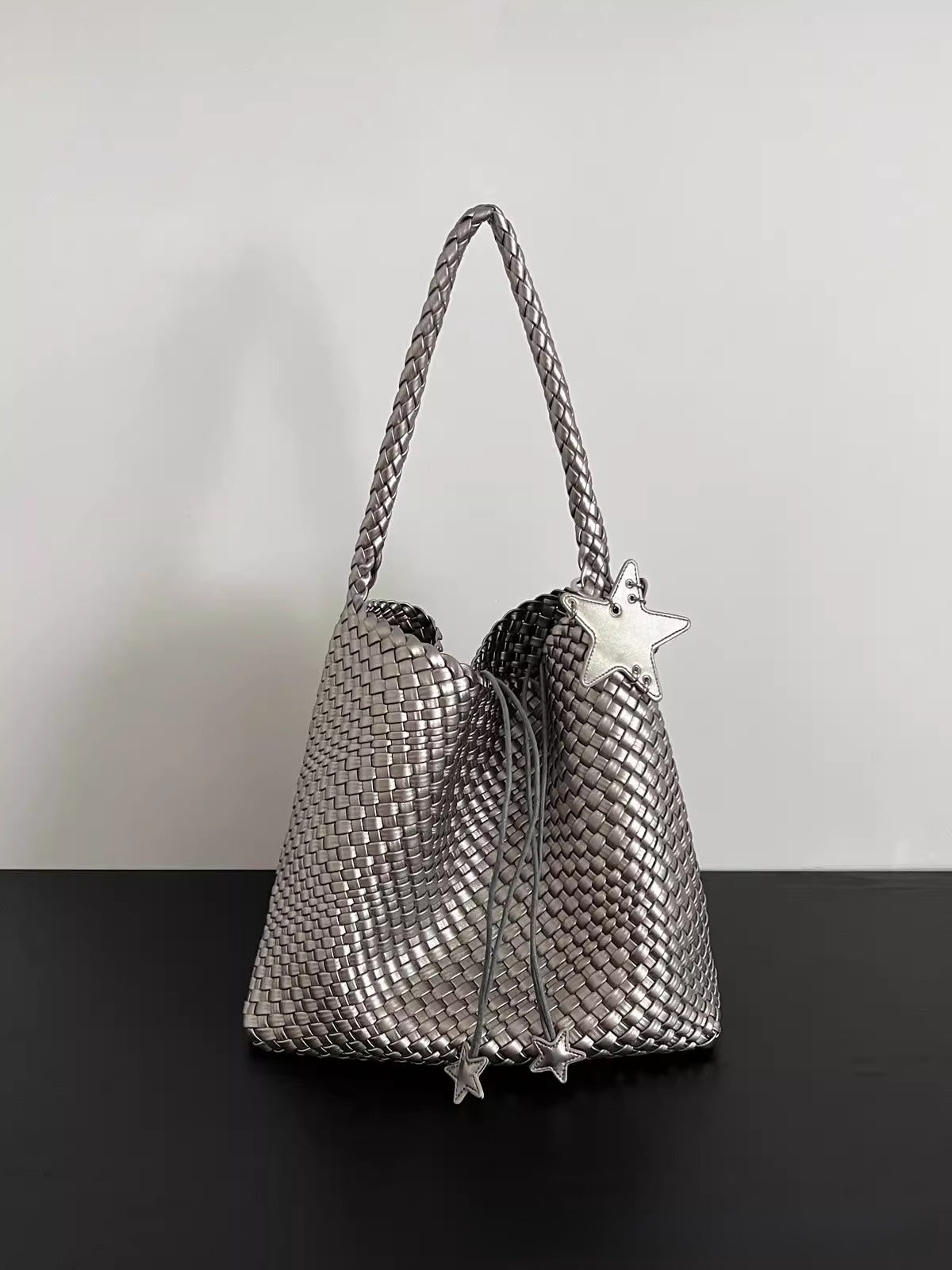 Champagne-colored woven tote bag