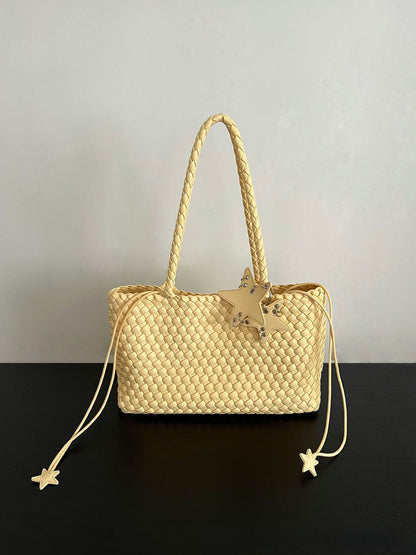 Champagne-colored woven tote bag