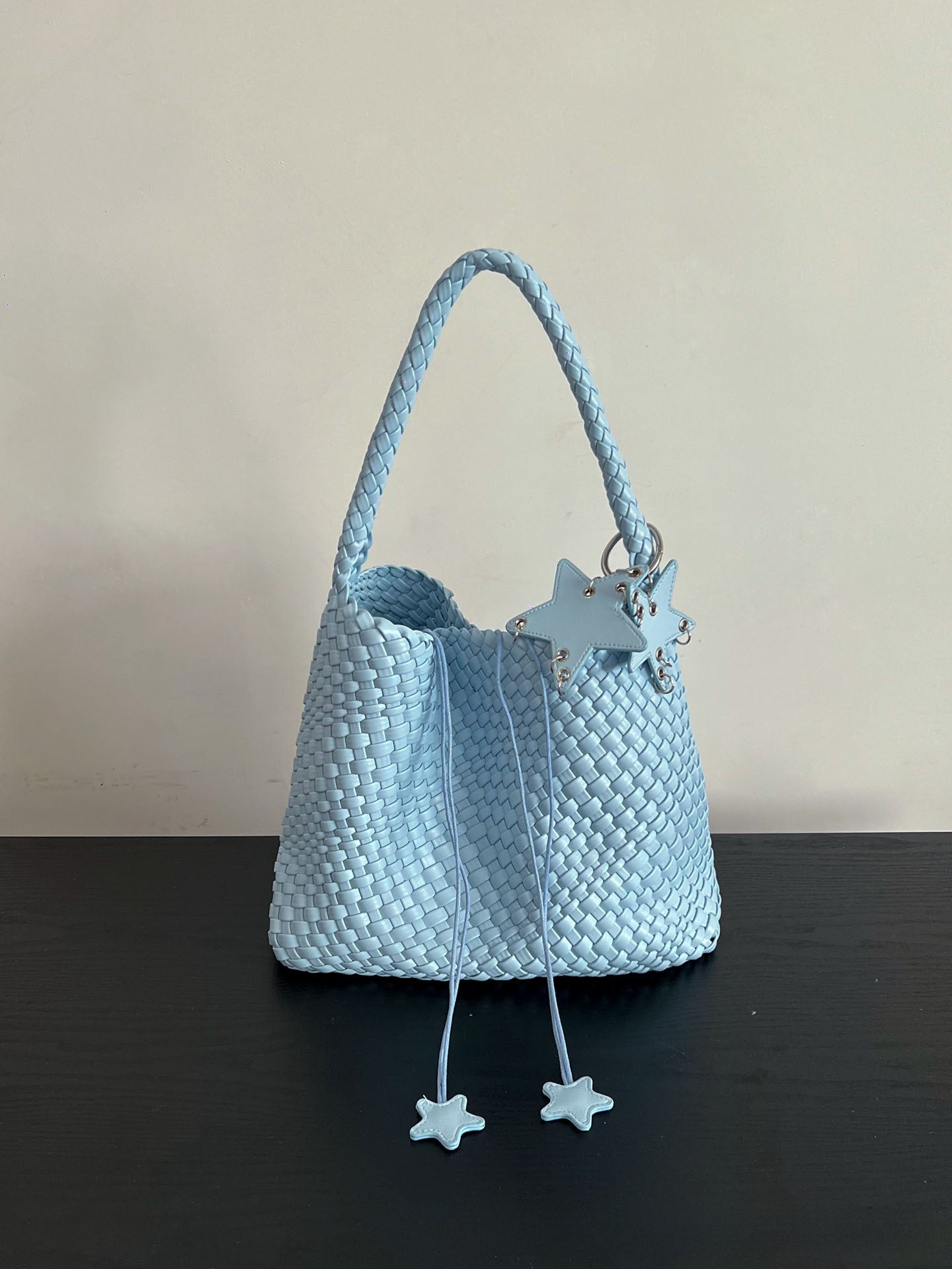 Champagne-colored woven tote bag