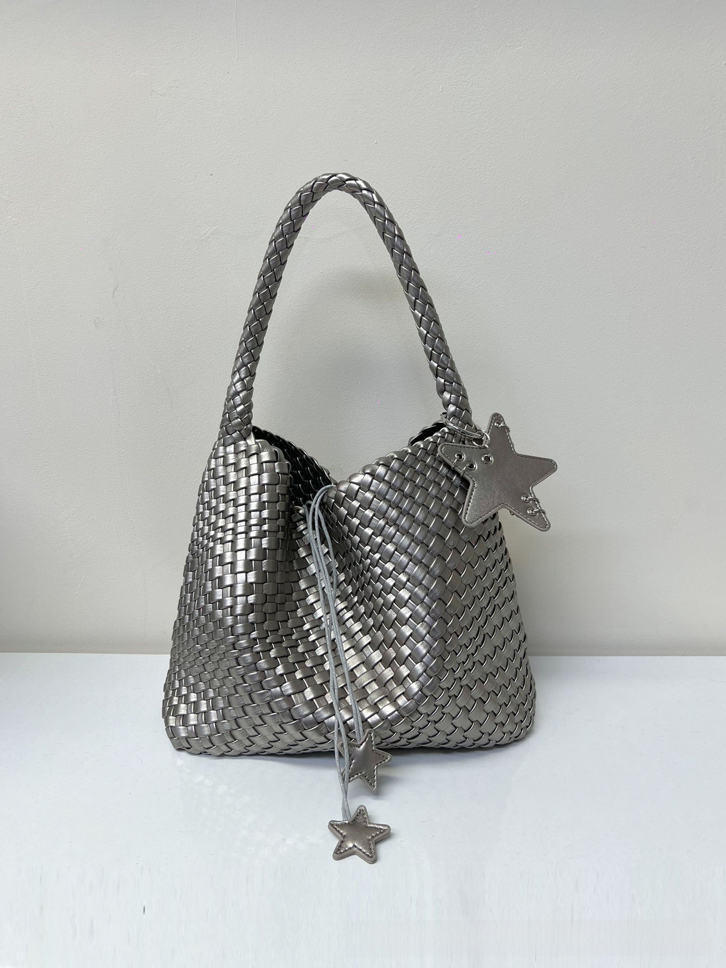 Champagne-colored woven tote bag