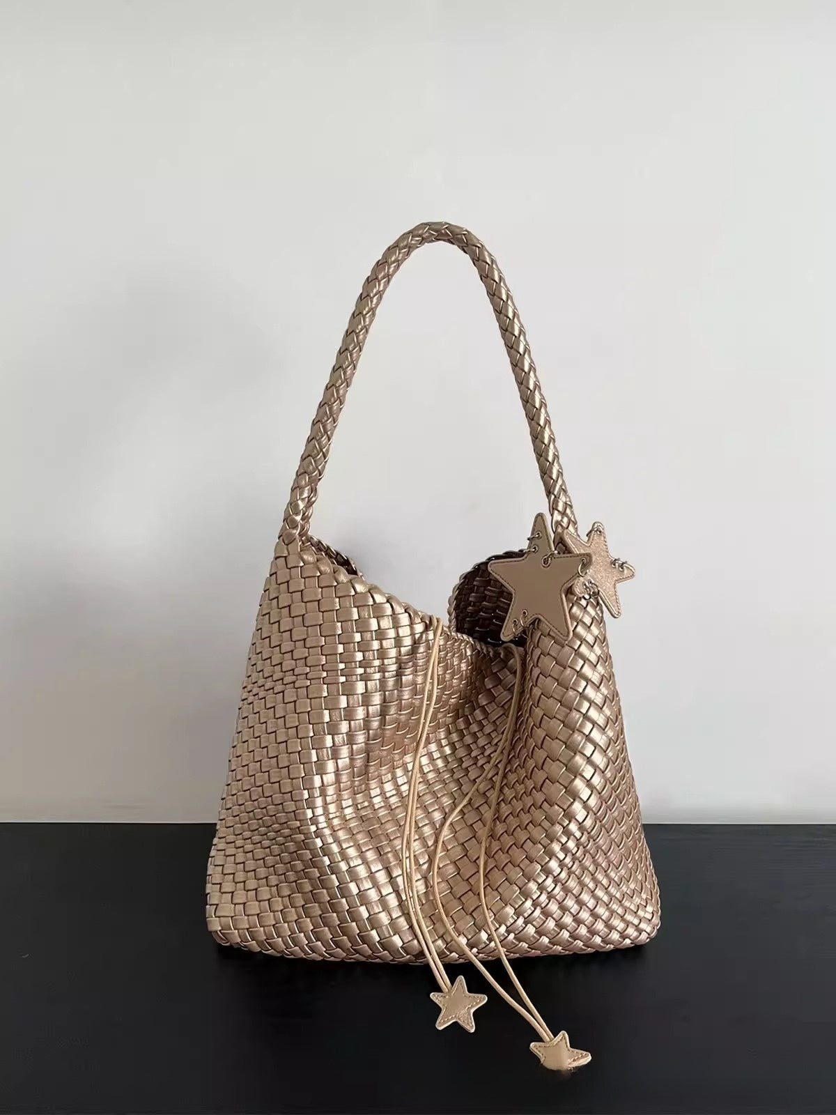 Champagne-colored woven tote bag