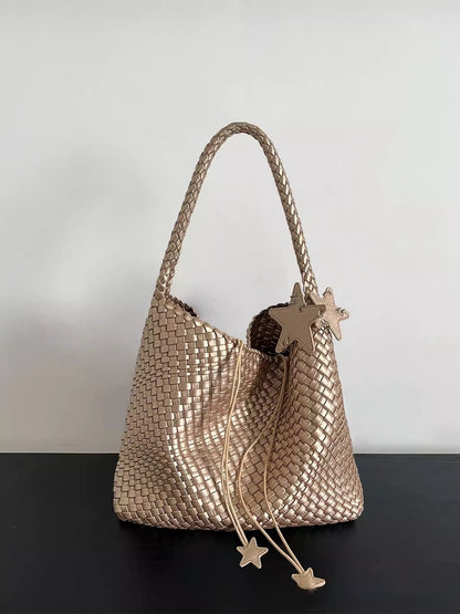 Champagne-colored woven tote bag