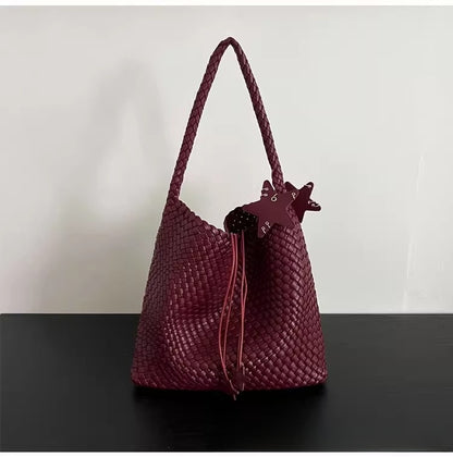 Champagne-colored woven tote bag