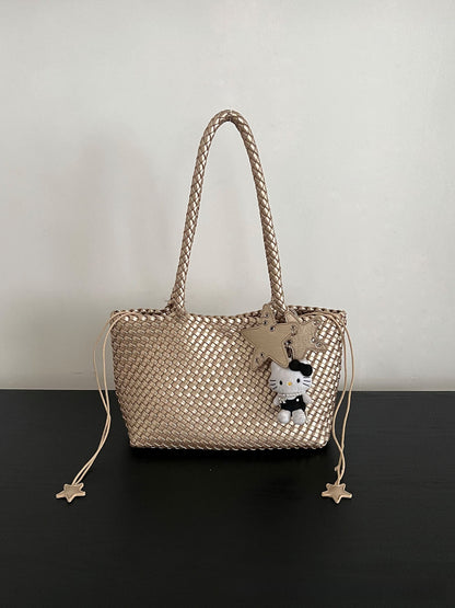Champagne-colored woven tote bag