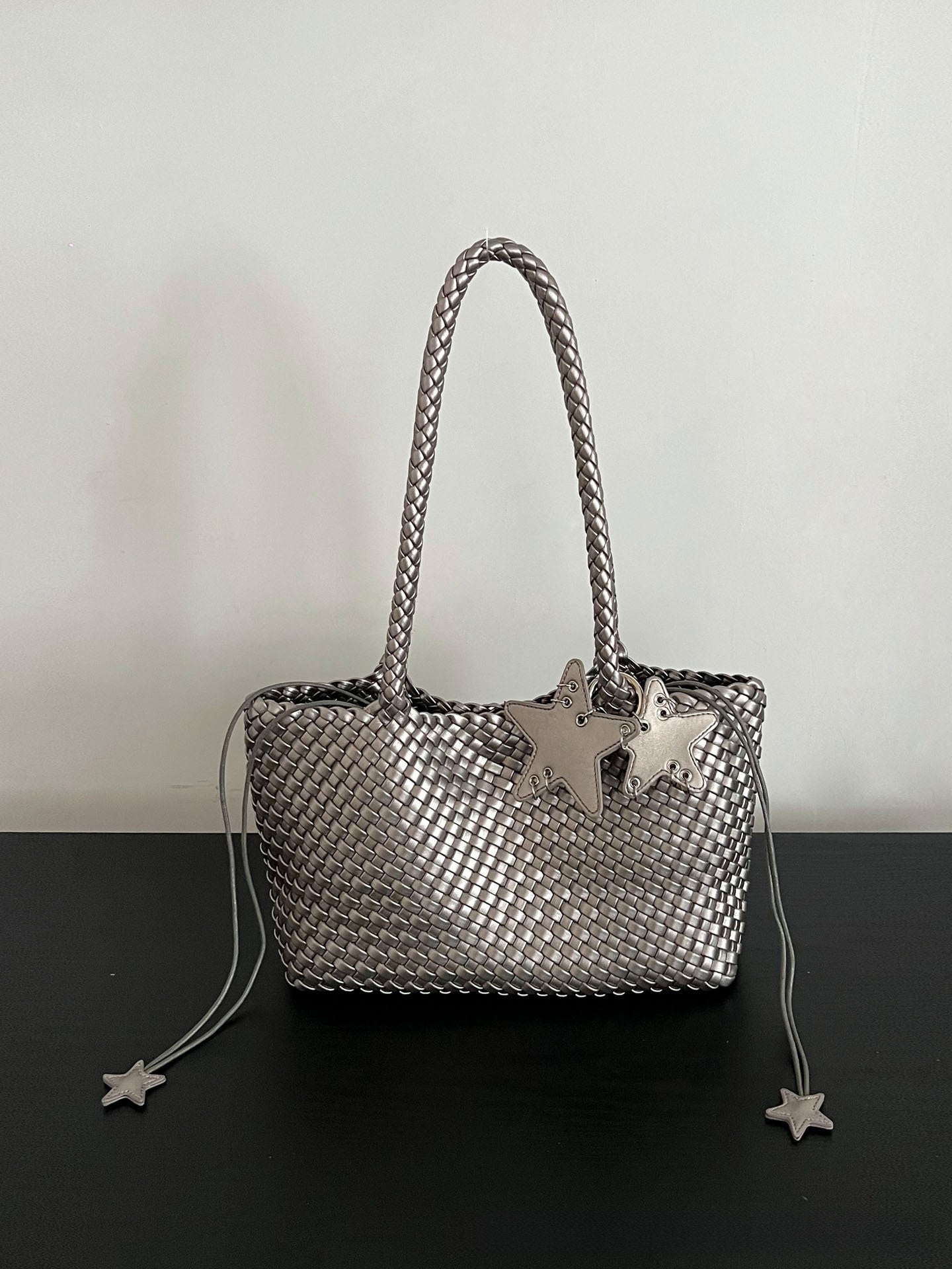 Champagne-colored woven tote bag