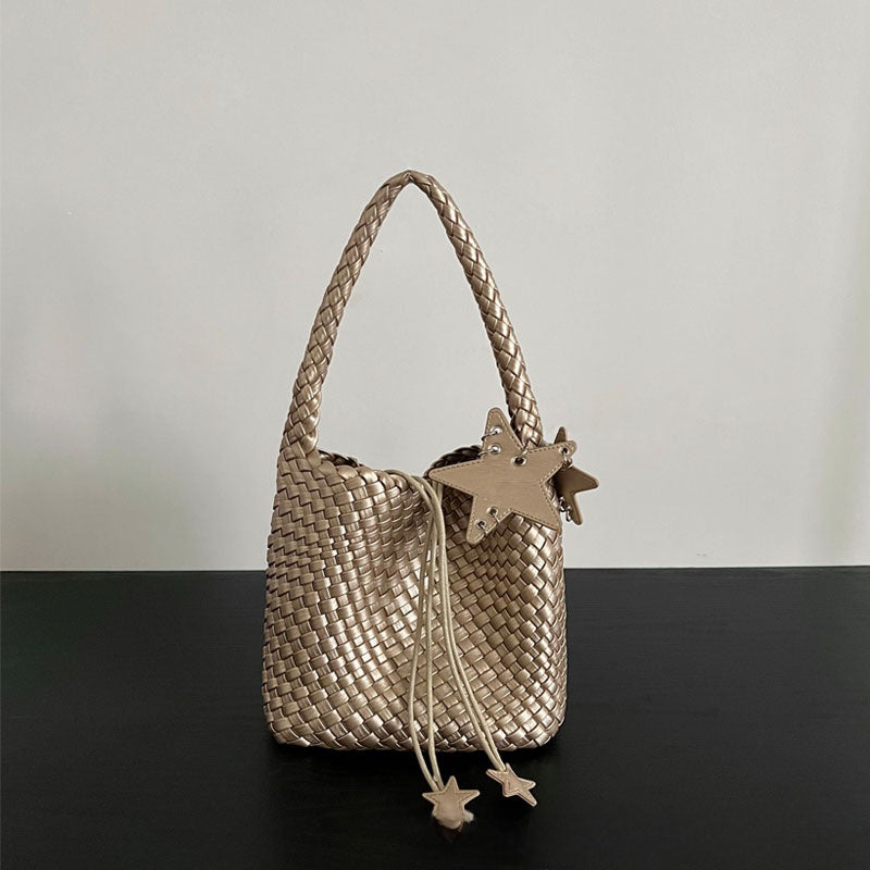 Champagne-colored woven tote bag